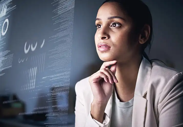 Woman in front of a screen full of information, futurist art to show how ai-driven decision can enhance productivity - Grarrick Solutions